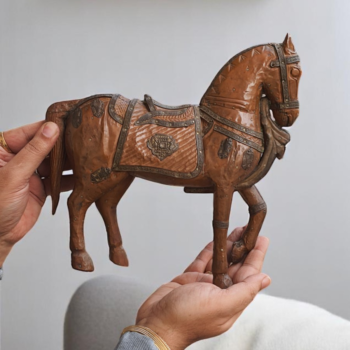 handcrafted wooden horse statue.